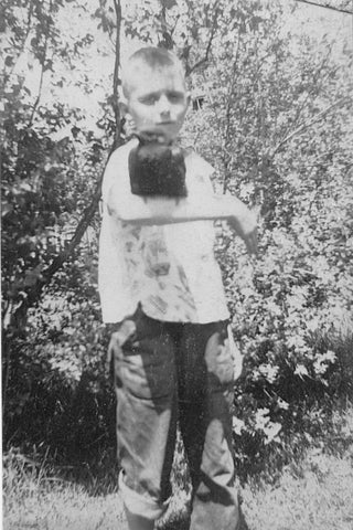 Photo: Founder's dad with his pet crow. Wisconsin, 1940.