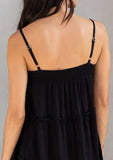 [Color: Black] A model wearing an ultra flowy sleeveless maxi dress, featuring a sweetheart neckline, an empire waist, and ruffled details. Perfect beach dress. 
