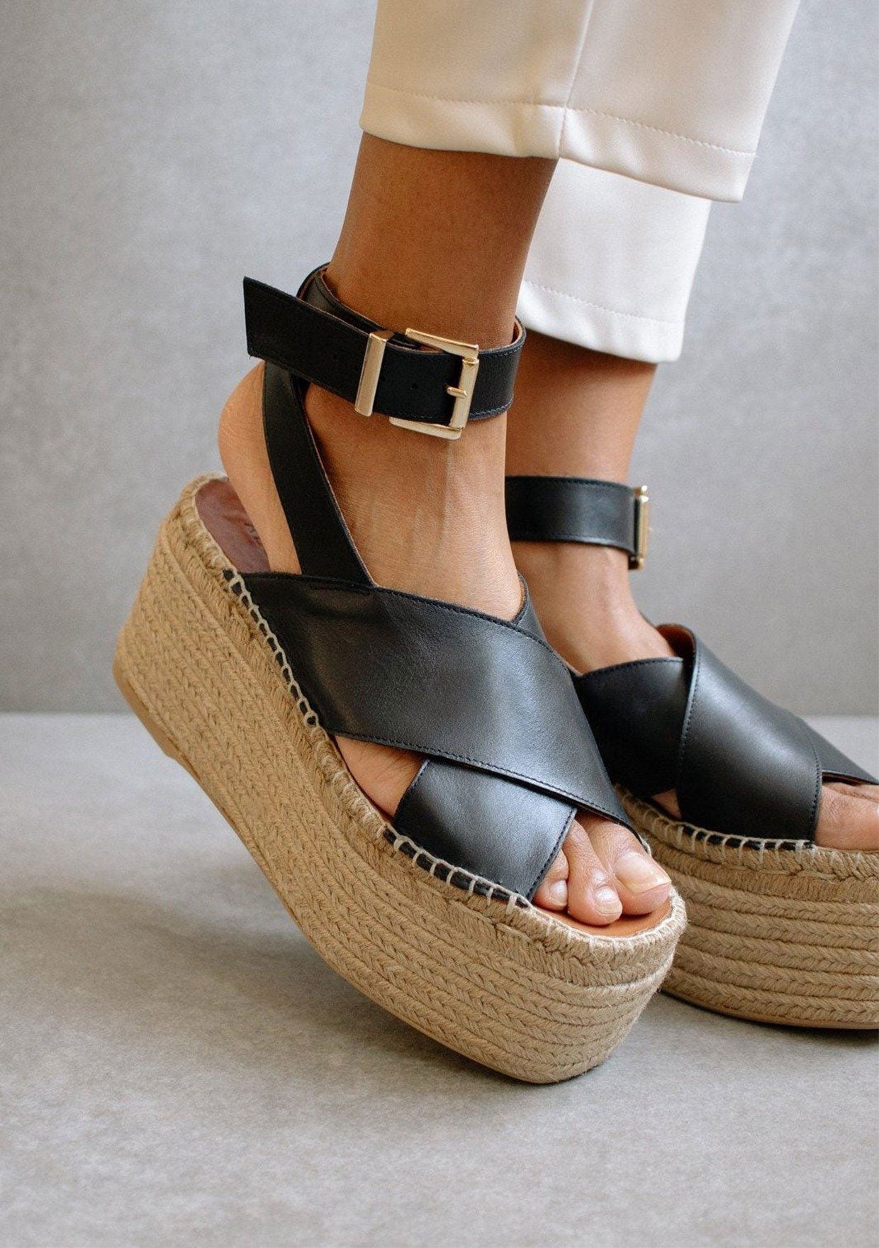 [Color: Black] Alohas elegant willow espadrille sandals with black criss crossed leather straps and a jute platform.