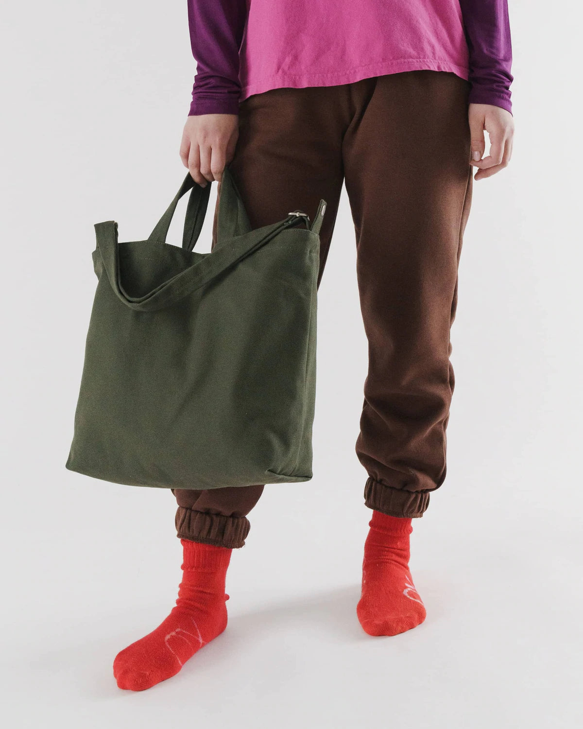 Person holding Baggu Horizontal Duck Bag - Cedar Green