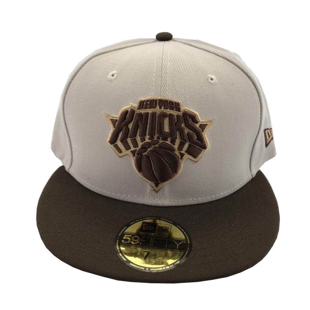 brown and white fitted cap