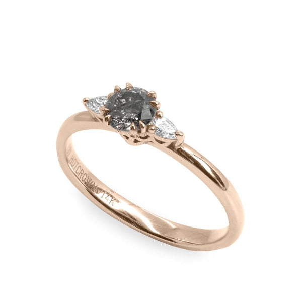 gold engagement ring with grey diamond