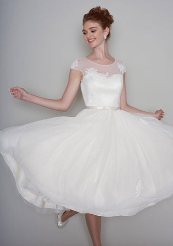 Lola is a pretty 50's style length tea dress with luxury lace appliqué and super full skirt