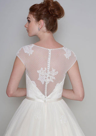 Rear view of the Lola Fifties style length tea dress with luxury lace appliqué and super full skirt