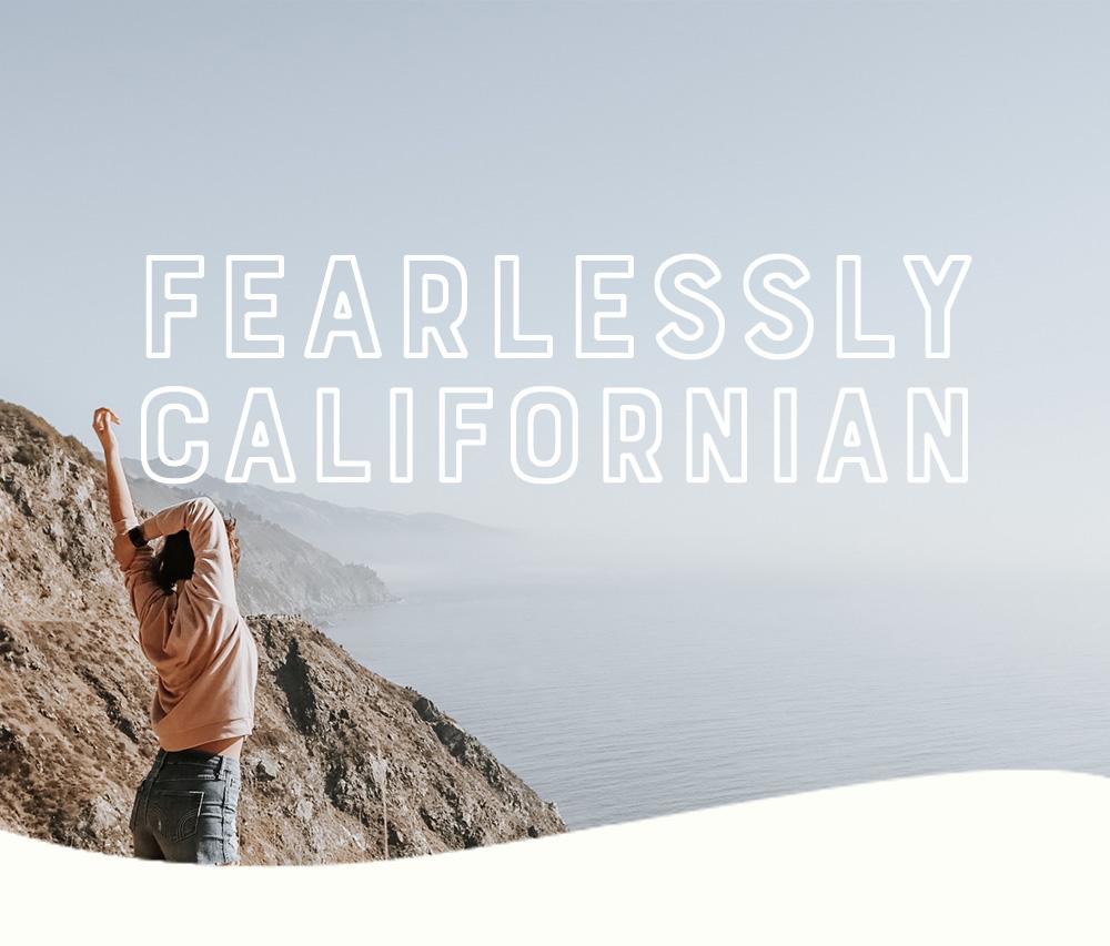 Fearlessly Californian - woman stretching in the mountains overlooking the sea
