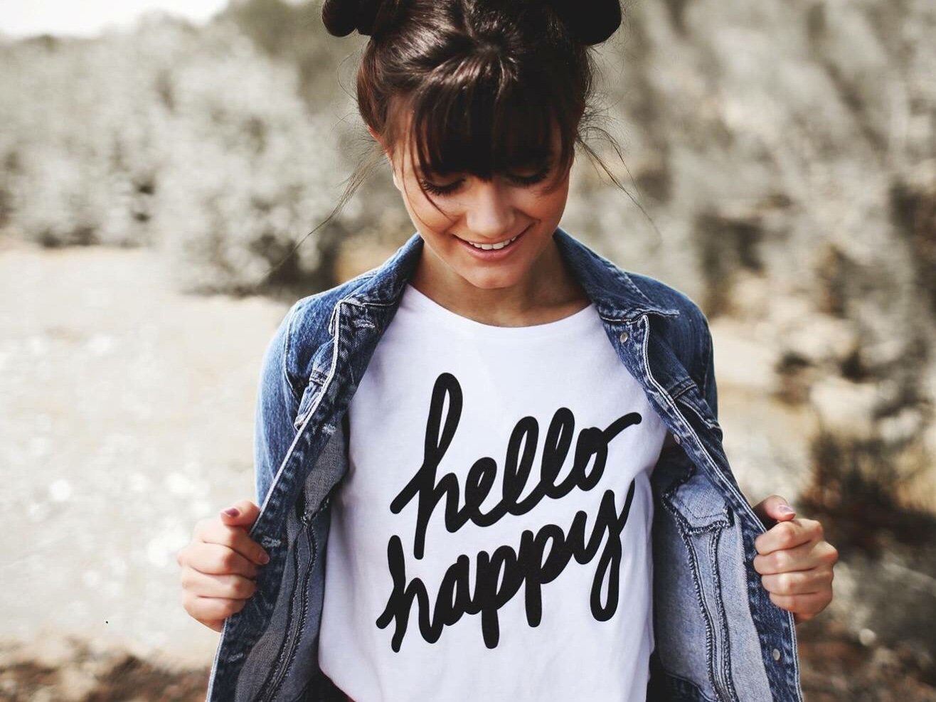 smiling girl with white t-shirt that reads Happy Girl
