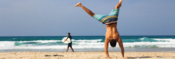 man-handstand-beach