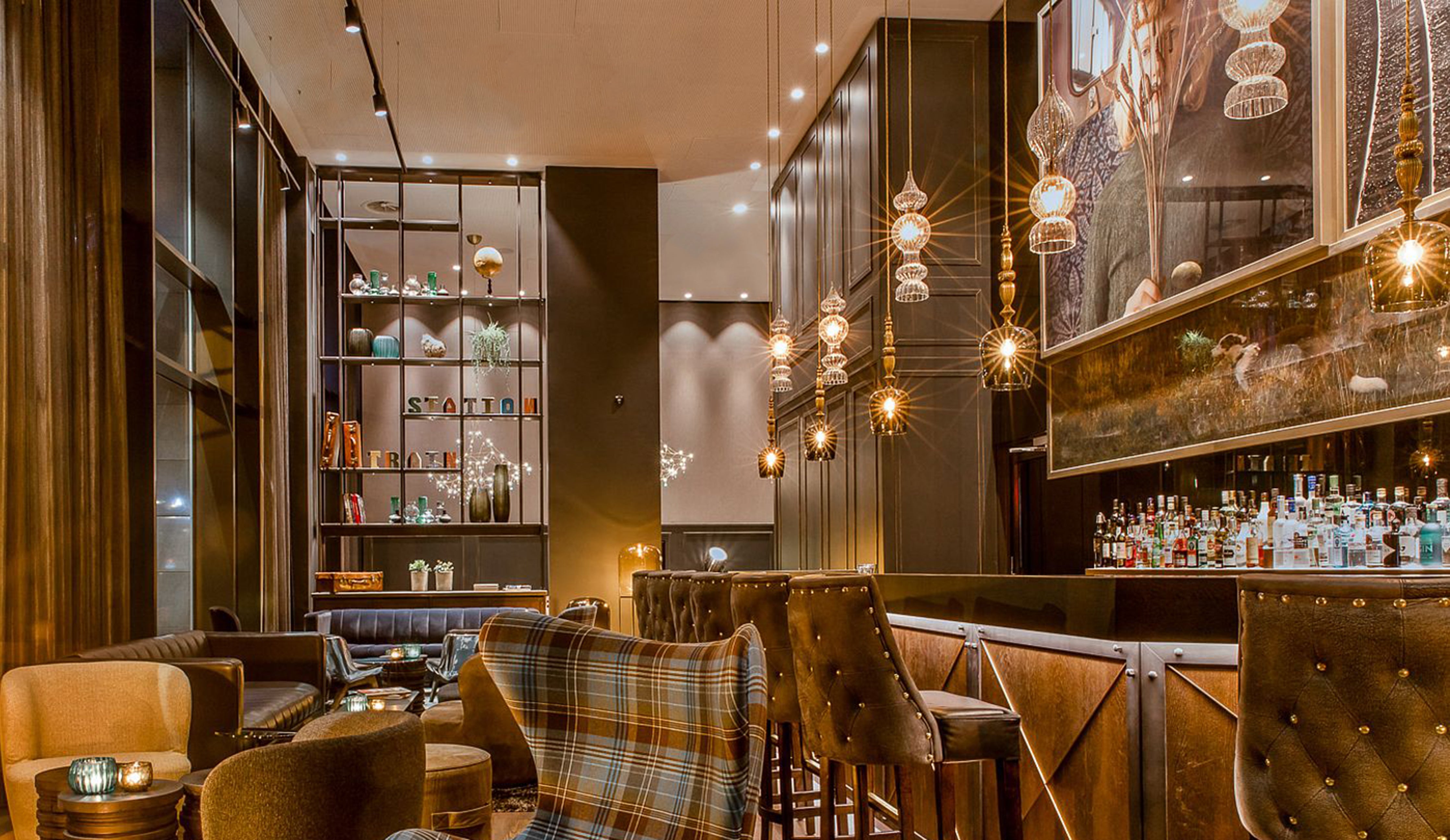 Standing and Spindle Pendants by Rothschild &amp; Bickers hanging over bar area in Motel One Glasgow