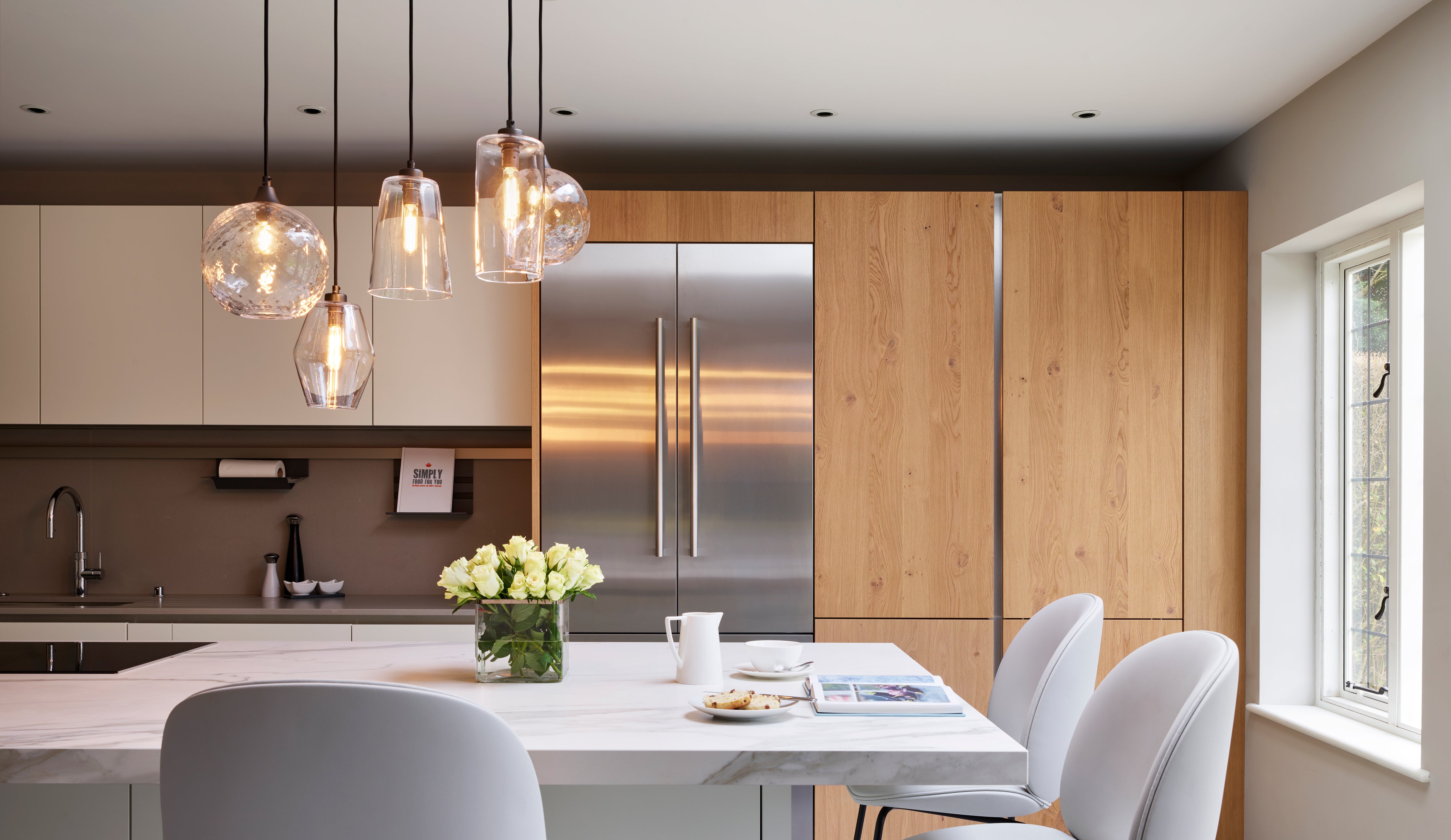 Pick-n-Mix Standard Pendants in clear diamond and plain glass finish over kitchen island by Neil lerner Design