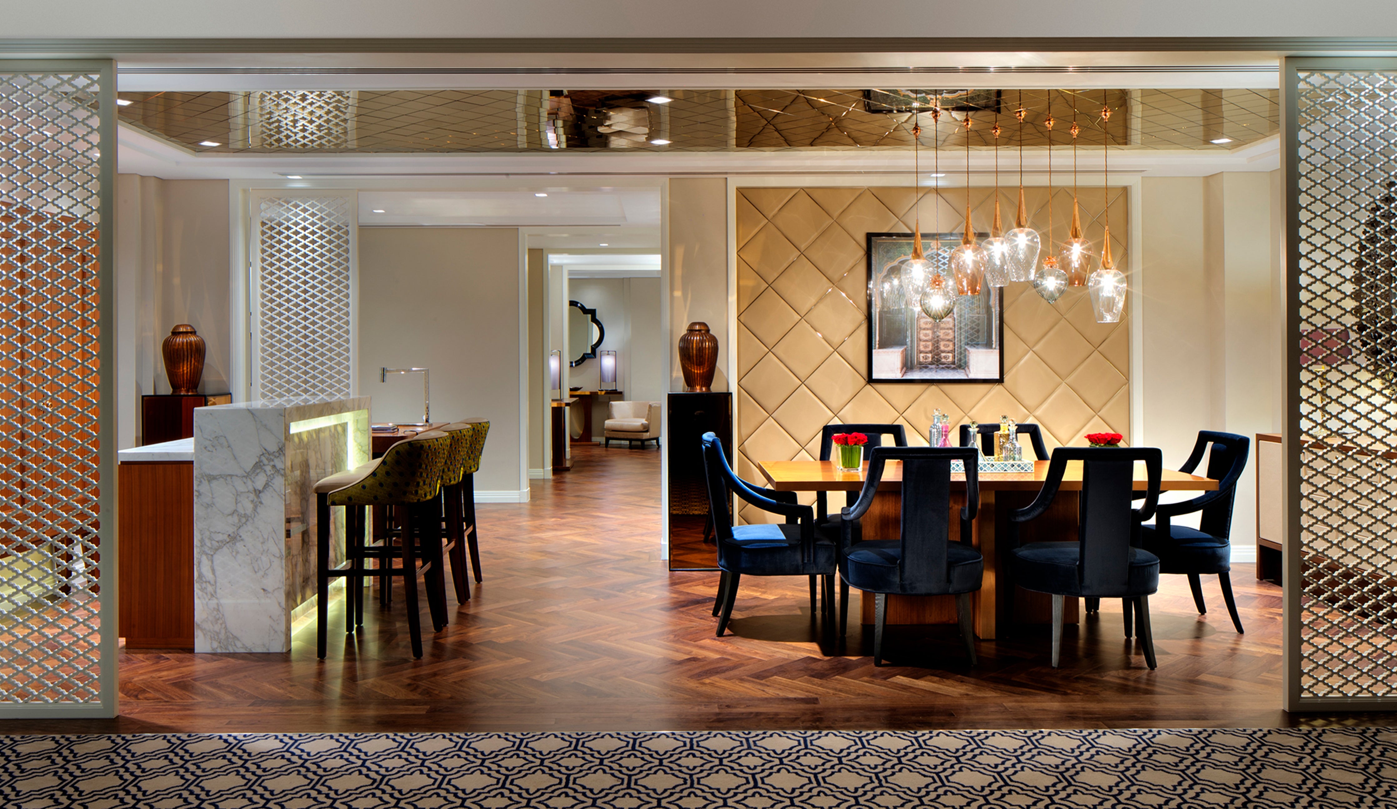 Retro Lights and Flora Pendants by Rothschild &amp; Bickers hanging over dining table at Taj Downtown Dubai