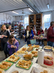 Guests get their soup, bread, and cookies in the Bay School's pottery studio