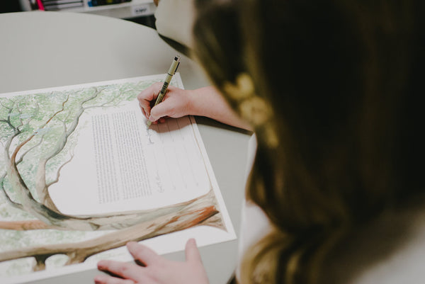 Jenna and Emily's Hip and Intimate Interfaith & Same-Sex Wedding in New York City | Signing the Live Oak Tree Ketubah | Tallulah Ketubahs