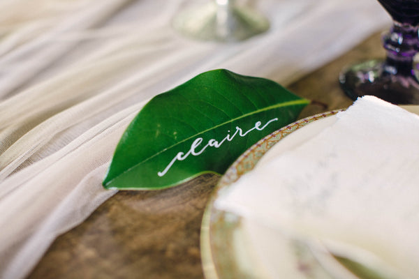 English Garden Party Styled Shoot at Bolingbroke Mansion | Calligraphy Magnolia Leaf Placecards | Tallulah Ketubahs