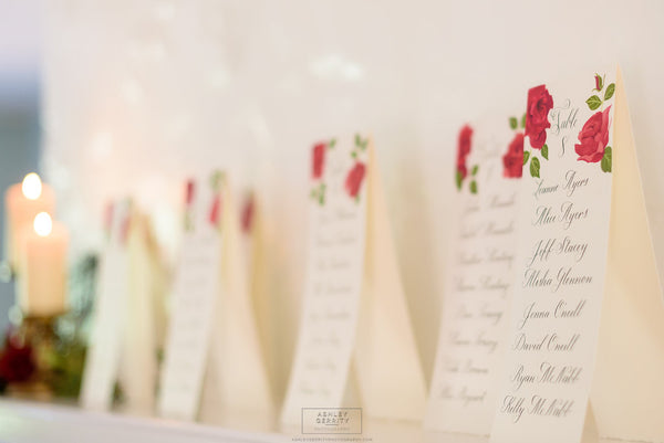 Spanish Rose Inspired Wedding at Bolingbroke Mansion | Hand Painted Rose Escort Cards with Black Calligraphy | Tallulah Ketubahs