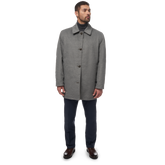 Load image into Gallery viewer, man wearing fully buttoned british khaki Men&#39;s Button-Up Reversible Raincoat front view
