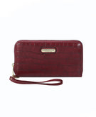  ruby red wallet with handle strap and gold-colored zipper
