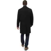  man wearing black microfiber raincoat back view
