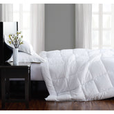  side view of white embossed seersucker comforter on bed
