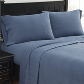  blue flannel sheet set on bed
