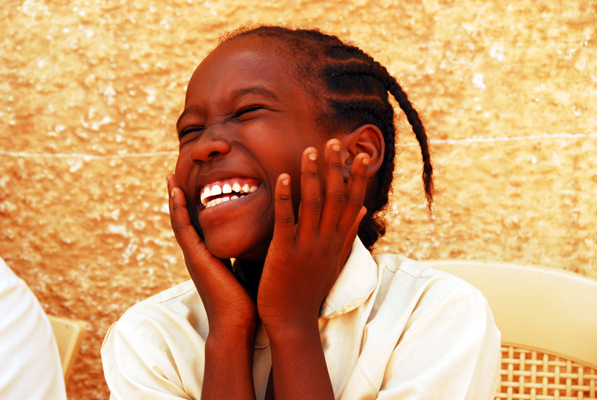 African girl laughing and happy.