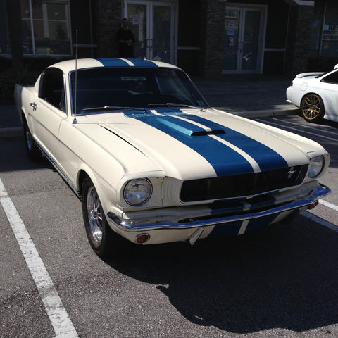 front view of a 1965 Ford Mustang GT350 fastback white with blue stripes