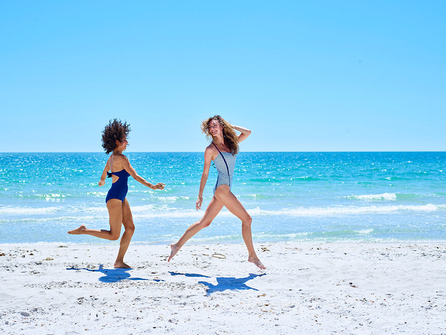 Charlotte and Elizabeth running on the beach