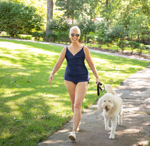 Jane walking dog in Navy Tankini