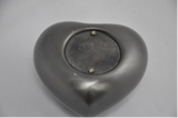 bottom of small metal urn