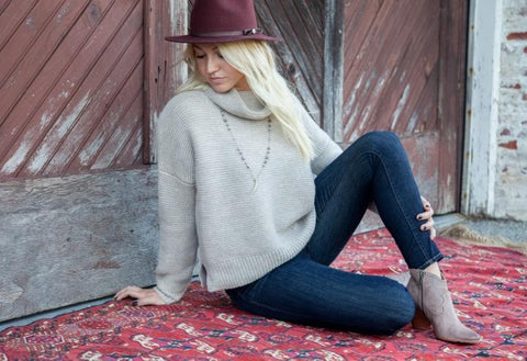 Laura Jean carries 360Sweater cashmere and Frye boots