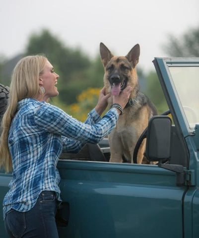 Model Gina Siebrandt plays with Ruby and Bracken at Sweet Berry Farm