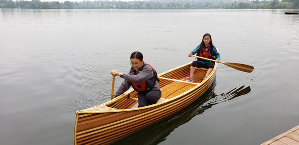 Paddling the finished cedar strip canoe