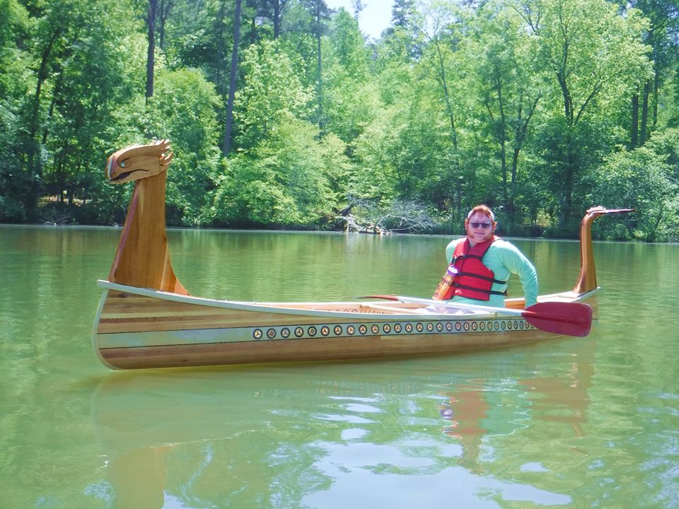 Dragon Canoe by Frank Turner on the water