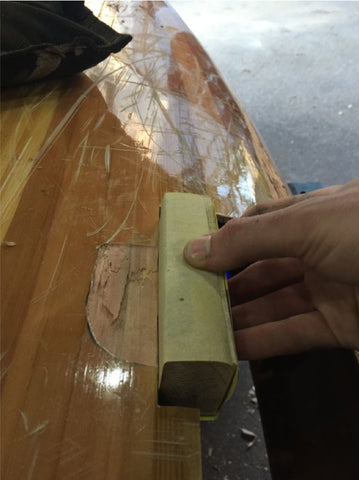 Sanding hull smooth to accommodate patch