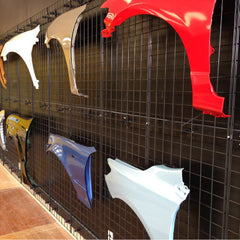 Wall of prepainted fenders set for shipping