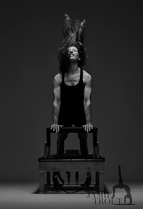 Gratz Gallery | Jamie Trout performing the Up Stretch exercise on the Universal Reformer