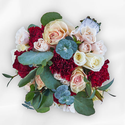 bride holding allure white bridal bouquet roses