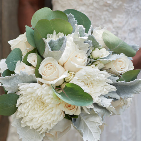 bride holding blissful white bridal bouquet roses disbud mum