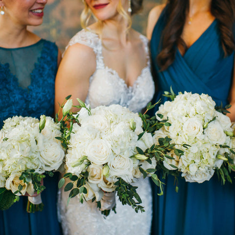 bridal party holding cherish blue-pink bridesmaid bouquet roses hydrangea