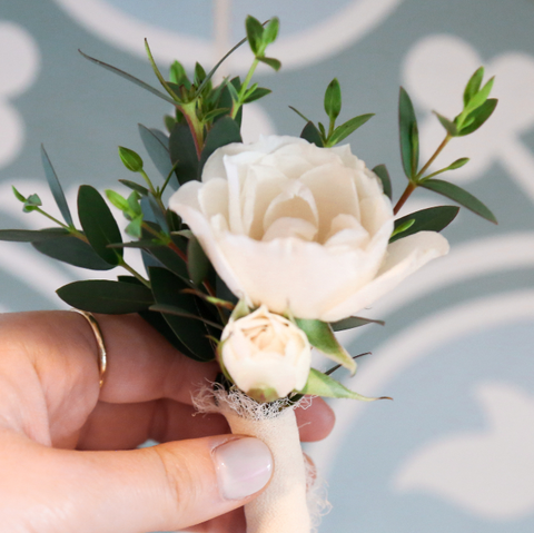 adore blush pin on corsage roses