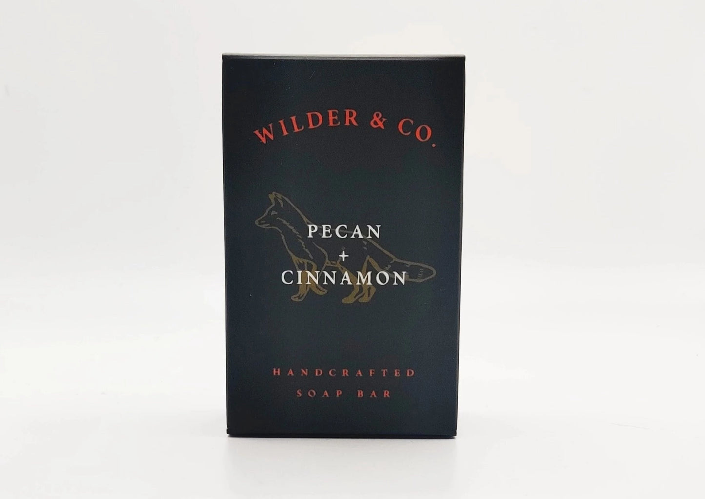 A black box with an illustration of a fox labeled as pecan and cinnamon soap by Wilder and Co.