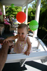 baby with balloon party decorations
