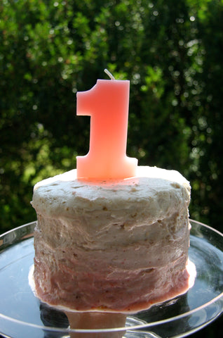 ombre pink tall round birthday cake for first birthday party for a little girl