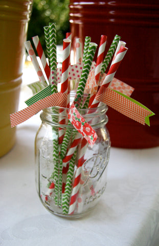 green chevron paper straws, red striped paper straws and coral dot paper straws with washi tape flags in a mason jar