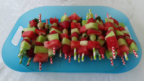 fruit kabobs for summer birthday party of watermelon, strawberry, raspberry, grapes and honeydew melon