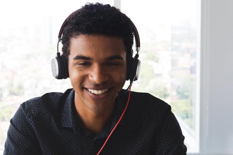 Shopify app challenge: smiling man wearing headphones