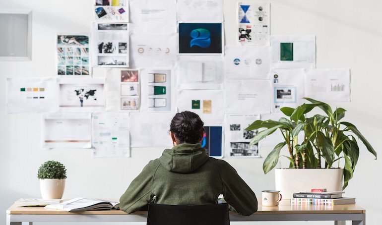 remote work: back shot of person sitting at a desk