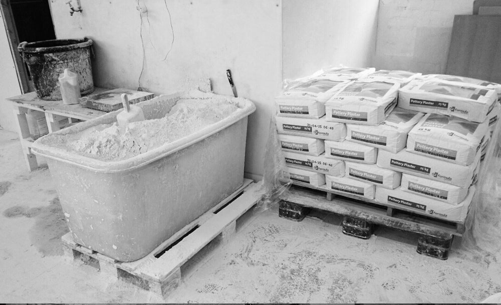 Mixing the plaster for the mug moulds