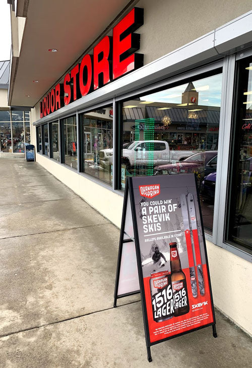 Outside the Vernon Square Liquor Store with poster display
