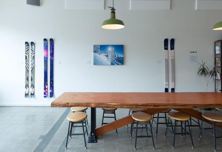 Geoff Holman print surrounded by Anton and Anders skis