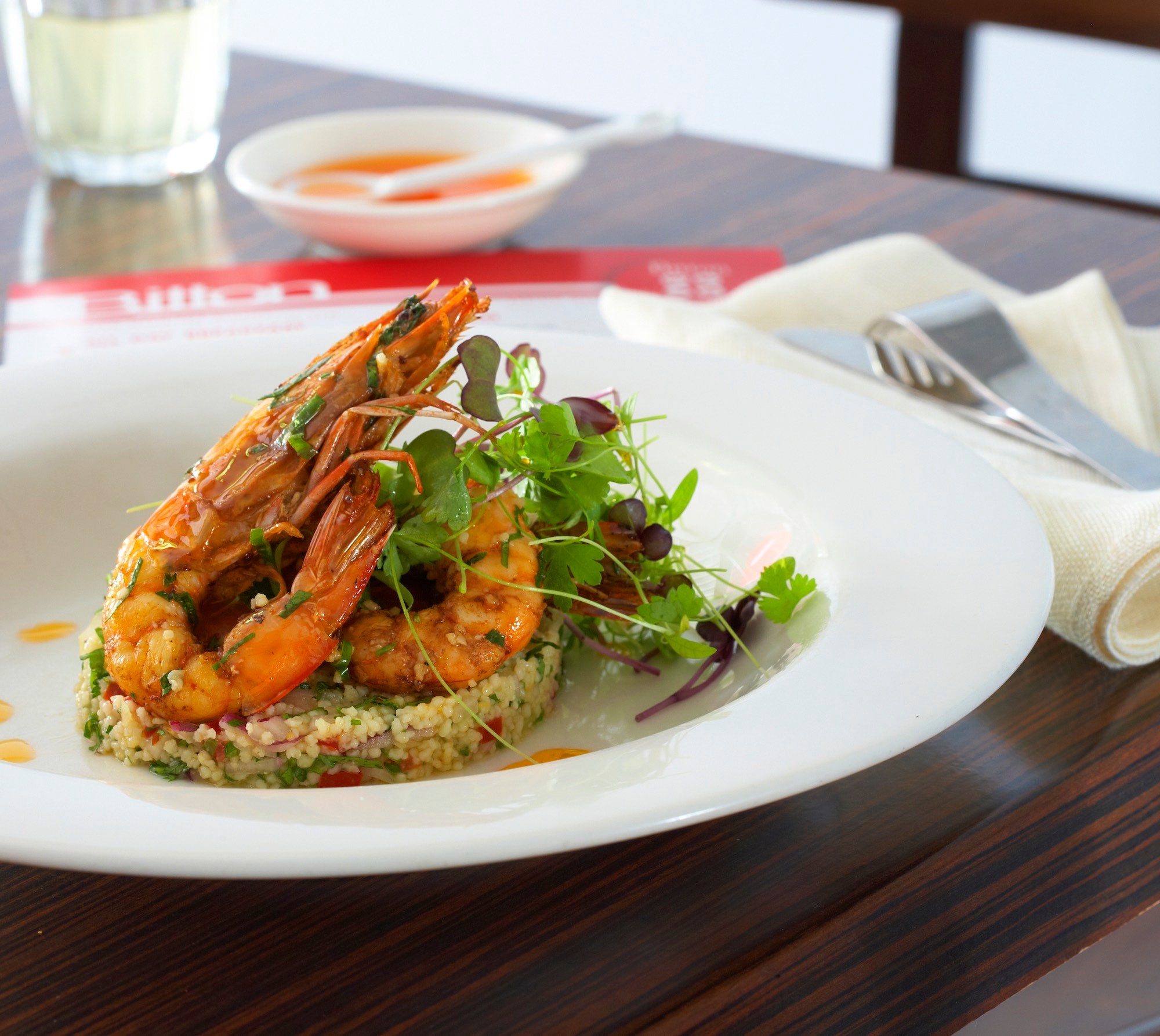 Chilli prawns on a bed of couscous